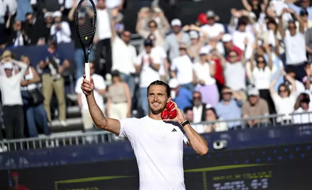 Germany's Alexander Zverev celebrates after winning against Hungary's Fabian Marozsan after the men's singles semi final tennis match at the ATP Tour in Munich, Germany, Saturday, April 19, 2025. (Sven Hoppe/dpa via AP)