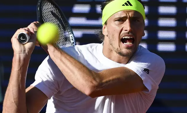 Germany's Alexander Zverev returns to Hungary's Fabian Marozsan during the men's singles semi final tennis match at the ATP Tour in Munich, Germany, Saturday, April 19, 2025. (Sven Hoppe/dpa via AP)