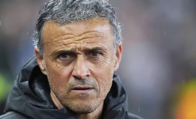 PSG's head coach Luis Enrique waits for the start of the Champions League quarterfinal second leg soccer match between Aston Villa and Paris Saint-Germain at Villa Park stadium, Birmingham, England, Tuesday, April 15, 2025. (AP Photo/Kirsty Wigglesworth)