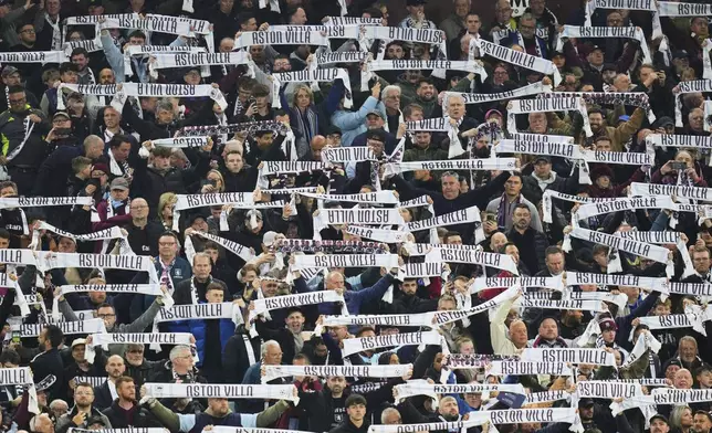Aston Villa fans cheer ahead of the Champions League quarterfinal second leg soccer match between Aston Villa and Paris Saint-Germain at Villa Park stadium, Birmingham, England, Tuesday, April 15, 2025. (AP Photo/Kirsty Wigglesworth)