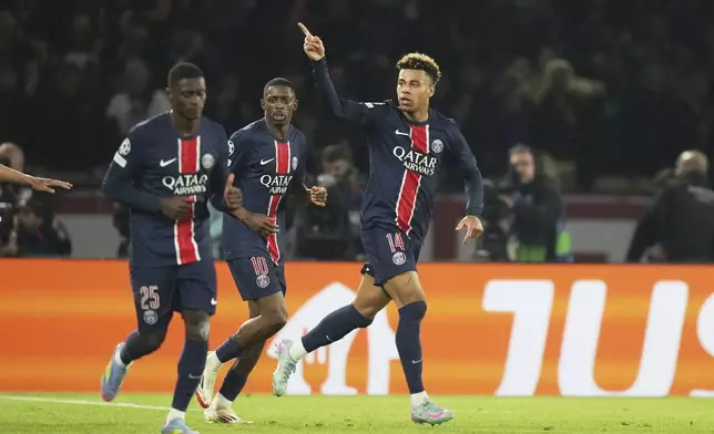 PSG's Desire Doue celebrates after scoring his side's first goal during the Champions League quarterfinal first leg soccer match between Paris Saint-Germain and Aston Villa at Parc des Princes stadium in Paris, Wednesday, April 9, 2025. (AP Photo/Thibault Camus)