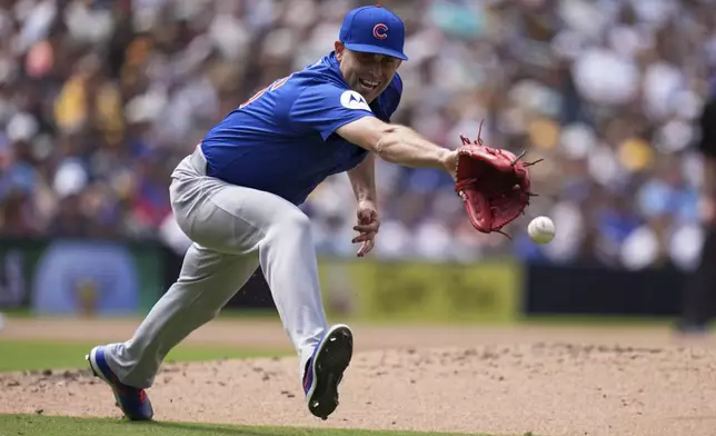 Chicago Cubs starting pitcher Matthew Boyd can't reach a hit for a single by San Diego Padres' Tyler Wade during the fifth inning of a baseball game Wednesday, April 16, 2025, in San Diego. (AP Photo/Gregory Bull)