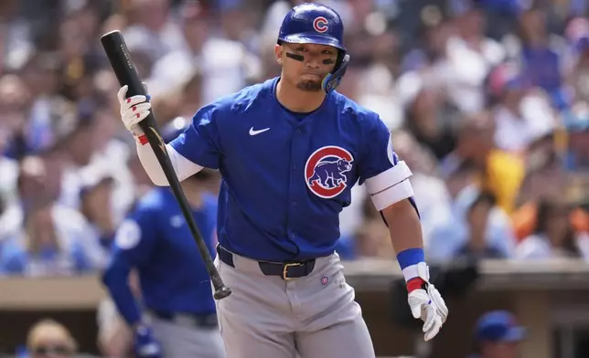 Chicago Cubs' Seiya Suzuki throws his bat as he pops out during the sixth inning of a baseball game against the San Diego Padres Wednesday, April 16, 2025, in San Diego. (AP Photo/Gregory Bull)