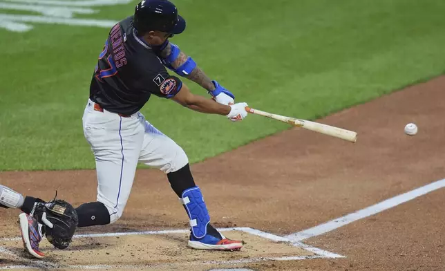New York Mets' Mark Vientos (27) hits an RBI double during the second inning of a baseball game against the Philadelphia Phillies Tuesday, April 22, 2025, in New York. (AP Photo/Frank Franklin II)