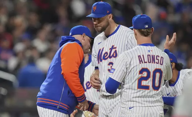 New York Mets pitcher Tylor Megill leaves during the sixth inning of a baseball game against the Philadelphia Phillies Monday, April 21, 2025, in New York. (AP Photo/Frank Franklin II)