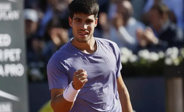 Spain's Carlos Alcaraz reacts during the ATP Barcelona Open tennis final agaisnt Denmark's Holger Rune in Barcelona, Spain, Sunday, April 20, 2025. AP Photo/Joan Monfort)