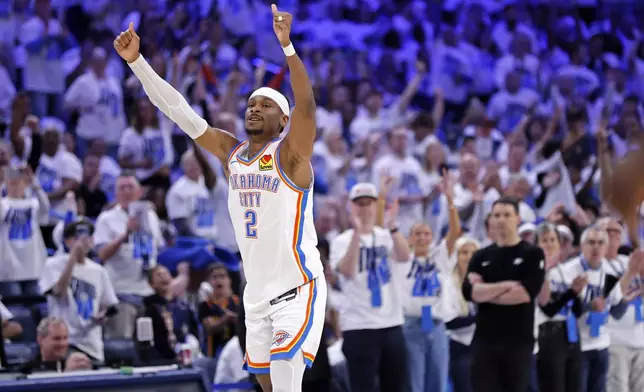 Oklahoma City Thunder guard Shai Gilgeous-Alexander reacts after making a basket during the first half in Game 1 of an NBA first-round playoff series against the Memphis Grizzlies, Sunday, April 20, 2025, in Oklahoma City. (AP Photo/Nate Billings)
