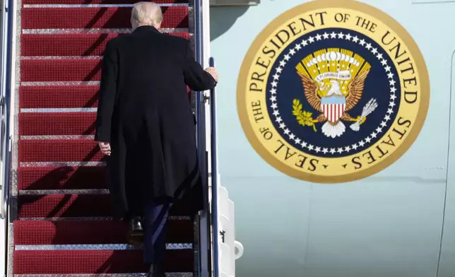 President Donald Trump boards Air Force One at Joint Base Andrews, Md., Friday, Feb. 14, 2025, en route to West Palm Beach, Fla. (AP Photo/Ben Curtis)