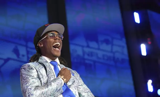 Kentucky cornerback Maxwell Hairston celebrates after being chosen by the Buffalo Bills with the 30th overall pick during the first round of the NFL football draft, Thursday, April 24, 2025, in Green Bay, Wis. (AP Photo/Jeff Roberson)