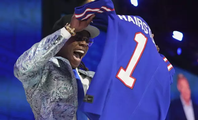 Kentucky cornerback Maxwell Hairston celebrates after being chosen by the Buffalo Bills with the 30th overall pick during the first round of the NFL football draft, Thursday, April 24, 2025, in Green Bay, Wis. (AP Photo/Jeff Roberson)