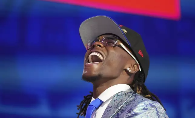 Kentucky cornerback Maxwell Hairston celebrates after being chosen by the Buffalo Bills with the 30th overall pick during the first round of the NFL football draft, Thursday, April 24, 2025, in Green Bay, Wis. (AP Photo/Jeff Roberson)
