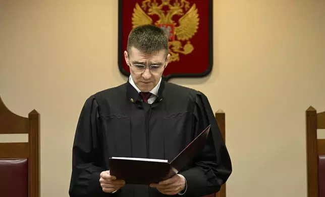 Russia's Supreme Court judge Oleg Nefyodov delivers a verdict lifting a ban on Afghanistan's Taliban, who were designated as a terrorist group more than two decades ago, in Moscow, Russia, Thursday, April 17, 2025. (AP Photo/Dmitry Serebryakov)
