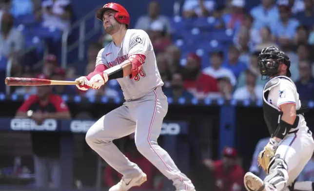 Cincinnati Reds' Austin Wynns (38) watches after hitting a solo home run during the third inning of a baseball game against the Miami Marlins, Wednesday, April 23, 2025, in Miami. (AP Photo/Lynne Sladky)