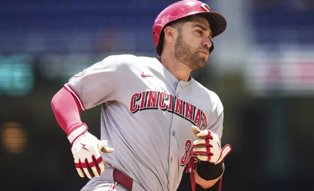 Cincinnati Reds' Austin Wynns runs the bases after hitting a solo home run during the third inning of a baseball game against the Miami Marlins, Wednesday, April 23, 2025, in Miami. (AP Photo/Lynne Sladky)