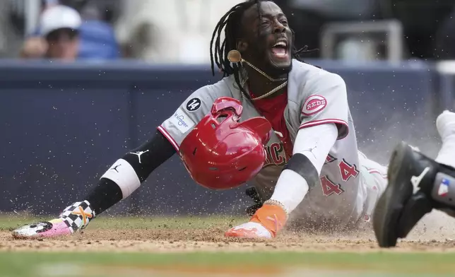 Cincinnati Reds' Elly De La Cruz scores during the eighth inning of a baseball game against the Miami Marlins, Wednesday, April 23, 2025, in Miami. (AP Photo/Lynne Sladky)