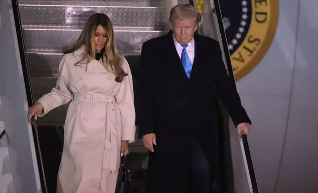 CORRECTS DATE TO APRIL 25 - President Donald Trump and first lady Melania Trump arrive on Air Force One at Rome's Leonardo da Vinci International airport in Fiumicino, Friday, April 25, 2025, to attend the funeral for Pope Francis at the Vatican. (AP Photo/Markus Schreiber)
