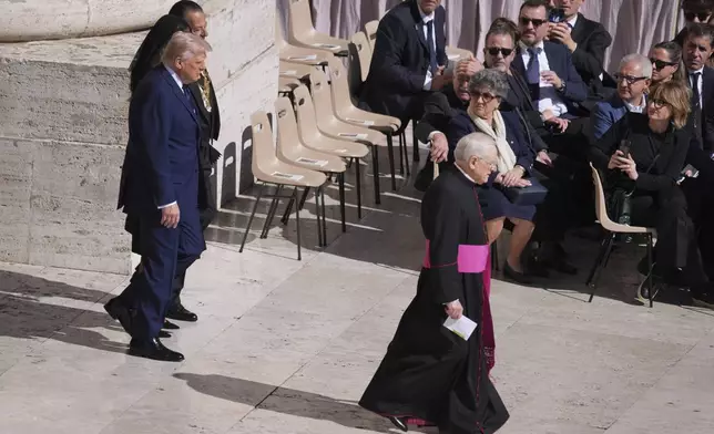 President Donald Trump and first lady Melania Trump, arrive for the funeral of Pope Francis in St. Peter's Square at the Vatican, Saturday, April 26, 2025. (AP Photo/Evan Vucci)