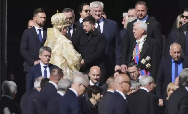 Ukraine's President Volodymr Zelenskyy, center, and other guests arrive, for the funeral of Pope Francis in St. Peter's Square at the Vatican, Saturday, April 26, 2025. (AP Photo/Andrew Medichini)