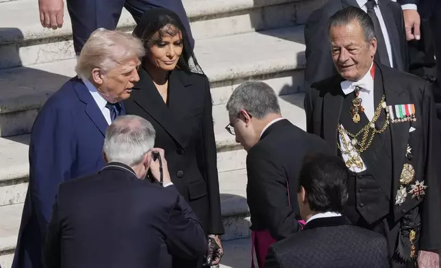 President Donald Trump, left, and first lady Melania Trump arrive for the funeral of Pope Francis in St. Peter's Square at the Vatican, Saturday, April 26, 2025. (AP Photo/Gregorio Borgia)
