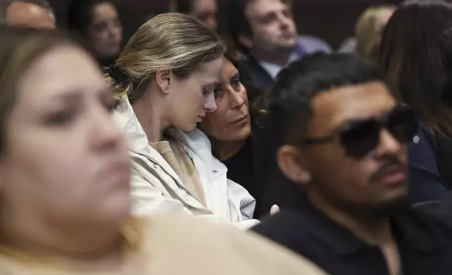 Survivors and family members of those killed react as Judge Victoria Rossetti sentences Robert Crimo III at the Lake County Courthouse, in Waukegan, Ill., on Thursday, April 24, 2025. (Stacey Wescott/Chicago Tribune via AP, Pool)
