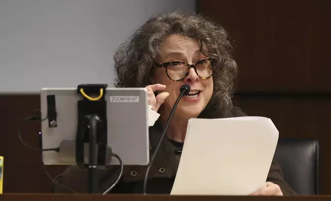 Erica Weeder speaks about her and her husband, John Kezdy, being shot by Robert E. Crimo III during his sentencing hearing at the Lake County Courthouse, in Waukegan, Ill., Thursday, April 24, 2025. (Stacey Wescott/Chicago Tribune via AP, Pool)