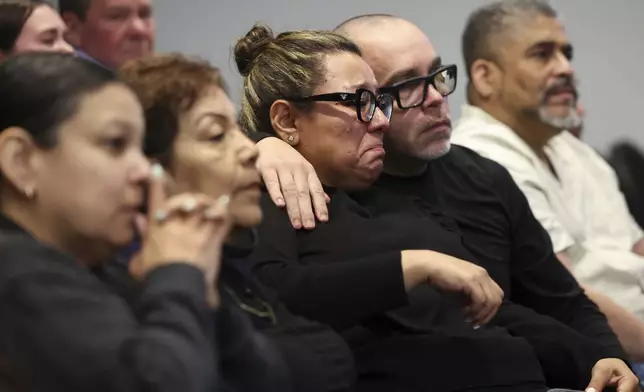 Members of Eduardo Uvaldo's family react as Judge Rossetti sentences Robert E. Crimo III to natural life in prison for his murder during the sentencing hearing at the Lake County Courthouse, in Waukegan, Ill., Thursday, April 24, 2025. (Stacey Wescott/Chicago Tribune via AP, Pool)