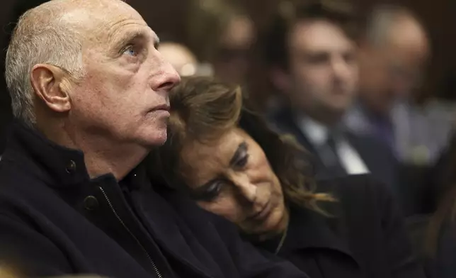 Joe Gutman looks up as his wife, Sheila Gutman, right, puts her head on his shoulder during the sentencing hearing for Robert E. Crimo III at the Lake County Courthouse, in Waukegan, Ill., Thursday, April 24, 2025. (Stacey Wescott/Chicago Tribune via AP, Pool)