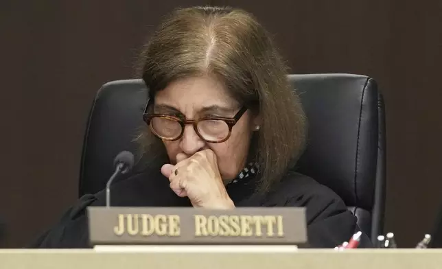 Judge Victoria A. Rossetti listens to Tracy Hartlieb while Tracy Hartlieb reads a victim impact statement during the sentencing hearing for Robert E. Crimo III., at the Lake County Courthouse, in Waukegan, Ill., Wednesday, April 23, 2025. (AP Photo/Nam Y. Huh, Pool)