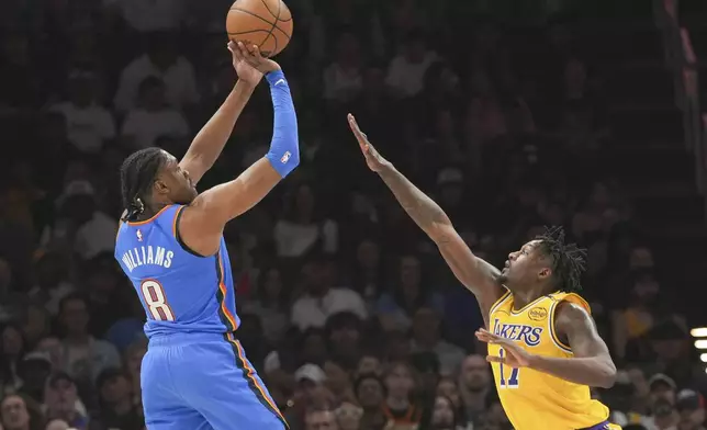 Oklahoma City Thunder forward Jalen Williams, left, shoots over Los Angeles Lakers forward Dorian Finney-Smith, right, during the first half of an NBA basketball game, Tuesday, April 8, 2025, in Oklahoma City. (AP Photo/Kyle Phillips)