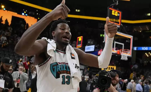 Memphis Grizzlies forward Jaren Jackson Jr. (13) celebrates the team's win after an NBA play-in tournament basketball game against the Dallas Mavericks, Friday, April 18, 2025, in Memphis, Tenn. (AP Photo/George Walker IV)
