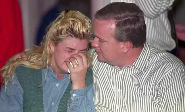 FILE - Family members wait for word about their missing relatives on April 19, 1995 at the First Christian Church in Oklahoma City, after a truck bomb exploded in the Alfred P. Murrah Federal Building. (AP Photo/J. Pat Carter, File)