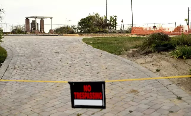 An empty lot sits alone along Old Coach Drive after the Mountain Fire burned through the area Wednesday, April 16, 2025, in Camarillo, Calif. (AP Photo/Wally Skalij)