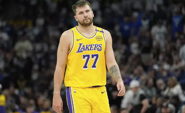 Los Angeles Lakers guard Luka Doncic reacts after a Lakers turnover during the first half of Game 3 of an NBA basketball first-round playoff series agains the Minnesota Timberwolves, Friday, April 25, 2025, in Minneapolis. (AP Photo/Abbie Parr)
