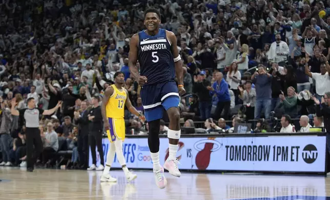Minnesota Timberwolves guard Anthony Edwards (5) celebrates after making a 3-point shot during the second half of Game 3 of an NBA basketball first-round playoff series against the Los Angeles Lakers, Friday, April 25, 2025, in Minneapolis. (AP Photo/Abbie Parr)