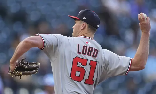 Washington Nationals starting pitcher Brad Lord works against the Colorado Rockies in the first inning of Game 2 of a split baseball doubleheader Sunday, April 20, 2025, in Denver. (AP Photo/David Zalubowski)