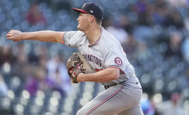 Washington Nationals starting pitcher Brad Lord works against the Colorado Rockies in the first inning of Game 2 of a split baseball doubleheader Sunday, April 20, 2025, in Denver. (AP Photo/David Zalubowski)