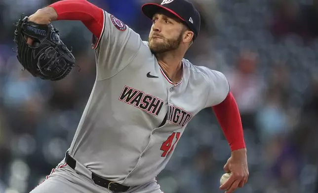 Washington Nationals relief pitcher Colin Poche works against the Colorado Rockies in the fifth inning of Game 2 of a split baseball doubleheader Sunday, April 20, 2025, in Denver. (AP Photo/David Zalubowski)