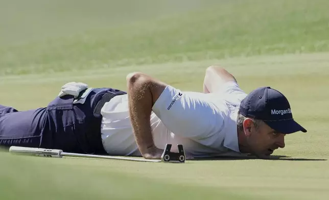 Justin Rose lines up a putt on the eighth hole during the second round at the Masters golf tournament, Friday, April 11, 2025, in Augusta, Ga. (AP Photo/Matt Slocum)