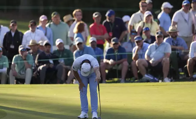Tyrrell Hatton, of England, reacts after missing a putt on the 17th hole during the second round at the Masters golf tournament, Friday, April 11, 2025, in Augusta, Ga. (AP Photo/Matt Slocum)