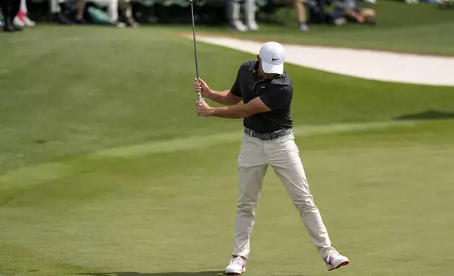 Rory McIlroy, of Northern Ireland, reacts after missing a putt on the 18th hole during the second round at the Masters golf tournament, Friday, April 11, 2025, in Augusta, Ga. (AP Photo/George Walker IV)