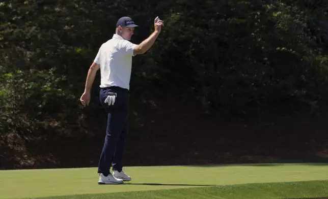 Justin Rose waves after making a putt on the 12th hole during the second round at the Masters golf tournament, Friday, April 11, 2025, in Augusta, Ga. (AP Photo/Matt Slocum)