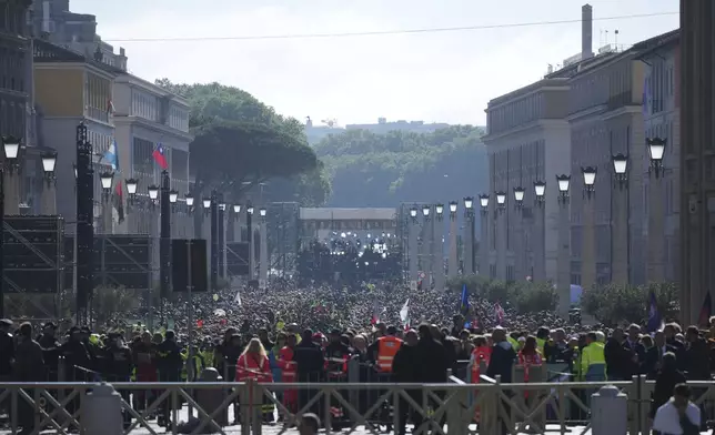 People queue trying to reach St. Peter's Square ahead of the funeral of Pope Francis at the Vatican, Saturday, April 26, 2025. (AP Photo/Andrew Medichini)