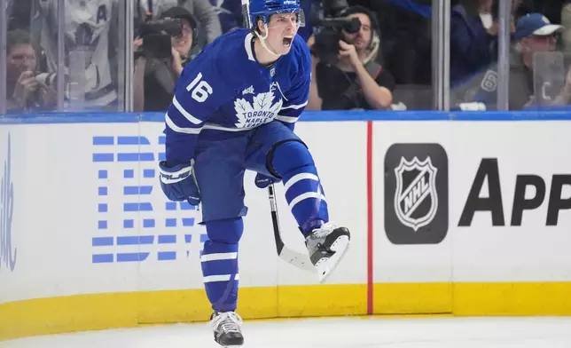 Toronto Maple Leafs' Mitch Marner (16) celebrates a goal against the Ottawa Senators during the first period of an NHL playoff hockey game in Toronto, Sunday April 20, 2025. (Frank Gunn/The Canadian Press via AP)