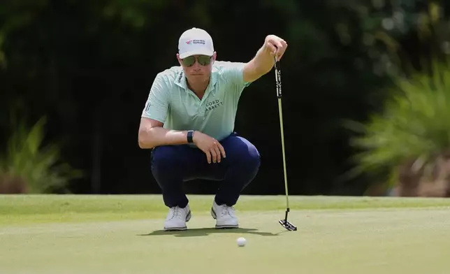 Ben Griffin lines up a shot on the 4th green during the final round of the PGA Zurich Classic golf tournament at TPC Louisiana in Avondale, La., Sunday, April 27, 2025. (AP Photo/Gerald Herbert)