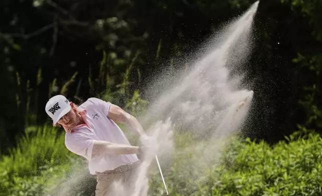 Jake Knapp hits out of the sand on the 5th fairway during the final round of the PGA Zurich Classic golf tournament at TPC Louisiana in Avondale, La., Sunday, April 27, 2025. (AP Photo/Gerald Herbert)