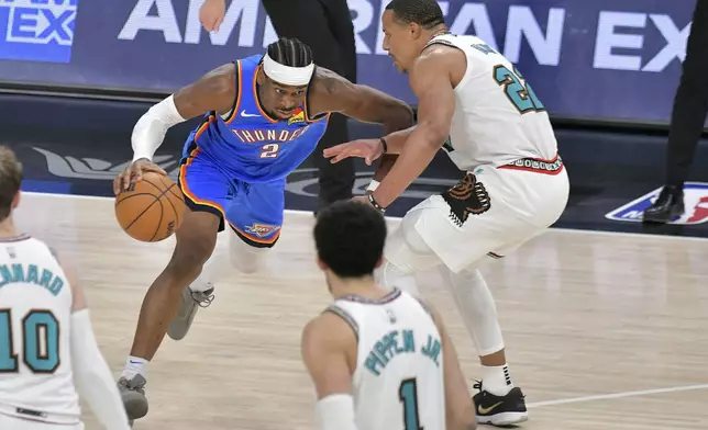 Oklahoma City Thunder guard Shai Gilgeous-Alexander (2) handles the ball against Memphis Grizzlies guard Desmond Bane (22) in the second half of Game 3 of an NBA first-round playoff series Thursday, April 24, 2025, in Memphis, Tenn. (AP Photo/Brandon Dill)