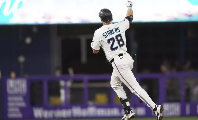 Miami Marlins' Kyle Stowers (28) runs the bases after hitting a three run home run during the seventh inning of a baseball game against the Cincinnati Reds, Monday, April 21, 2025, in Miami. (AP Photo/Lynne Sladky)