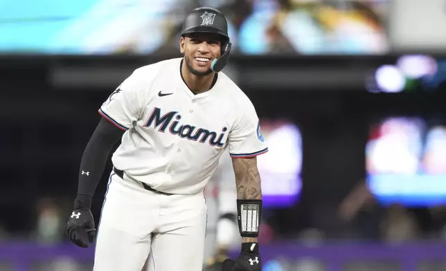 Miami Marlins' Agustin Ramirez reacts after hitting a double during the seventh inning of a baseball game against the Cincinnati Reds, Monday, April 21, 2025, in Miami. (AP Photo/Lynne Sladky)