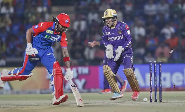 Kolkata Knight Riders' Rahamanullah Gurba, right, celebrates the runout dismissal of Delhi Capitals' KL Rahul, left, during the Indian Premier League cricket match between Delhi Capitals and Kolkata Knight Riders at Arun Jaitley Stadium in New Delhi, India, Tuesday, April 29, 2025. (AP Photo)
