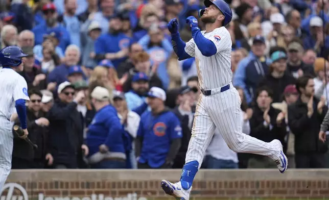 Chicago Cubs' Michael Busch runs the bases after hitting a home run during the second inning of a baseball game against the Arizona Diamondbacks, Saturday, April 19, 2025, in Chicago. (AP Photo/Erin Hooley)